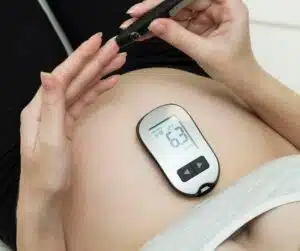 PCOS and Inositol pregnant woman checking blood sugar levels