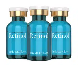 3d render of retinol vials over white background