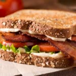 gluten free BLT sandwich on brown paper