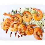 shrimps skewers on white plate