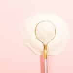 Inositol vs Metformin white powder with gold spoon